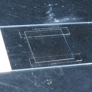 Slide and coverslip before valap Two spacers (made from a cut-up coverslip) make a flow chamber, creating a gap between the coverslip and the slide